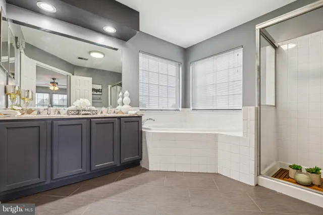 a bedroom with a bed couch and window