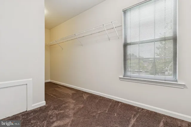 a bathroom with a granite countertop sink mirror and bathtub