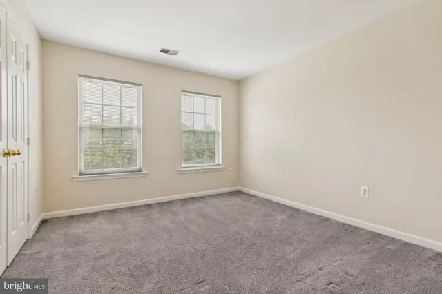 a bathroom with a granite countertop sink a toilet and a bathtub