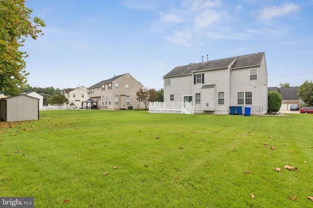 an aerial view of residential house with outdoor space and swimming pool