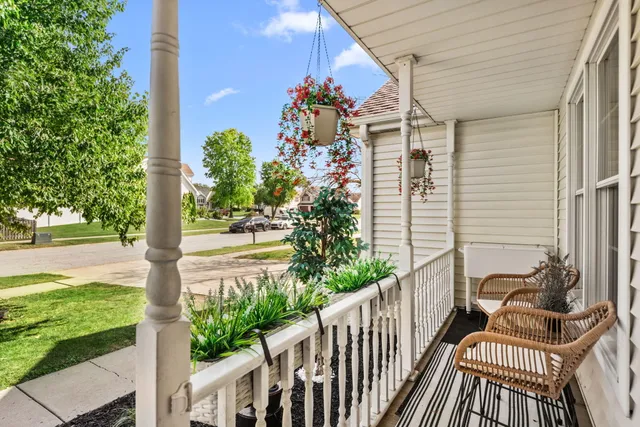 a view of a porch with furniture and yard