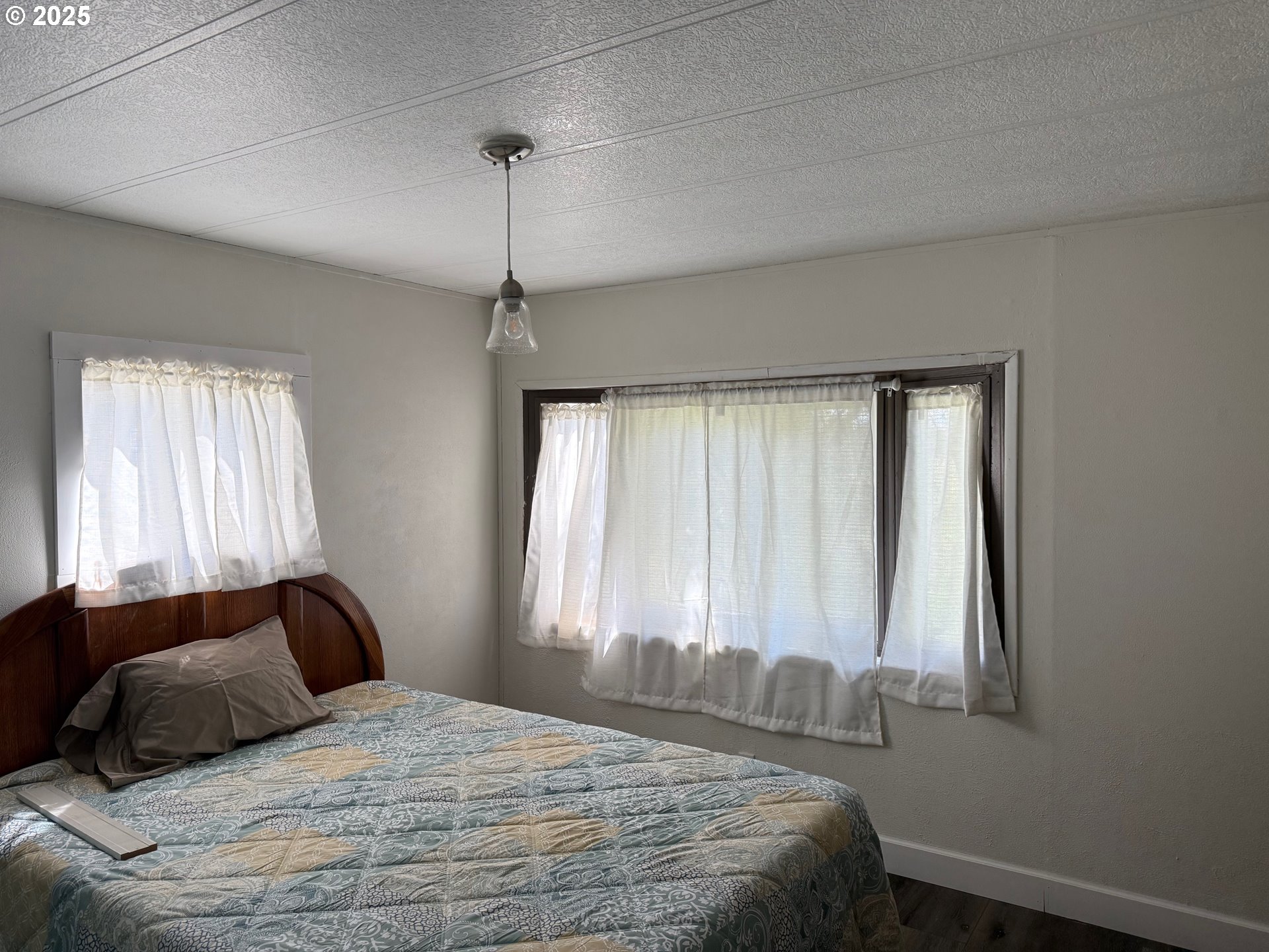63615 East Birch Creek Road Pilot Rock, OR 97868 - Photo 3 of 15 a bedroom with a bed and a window