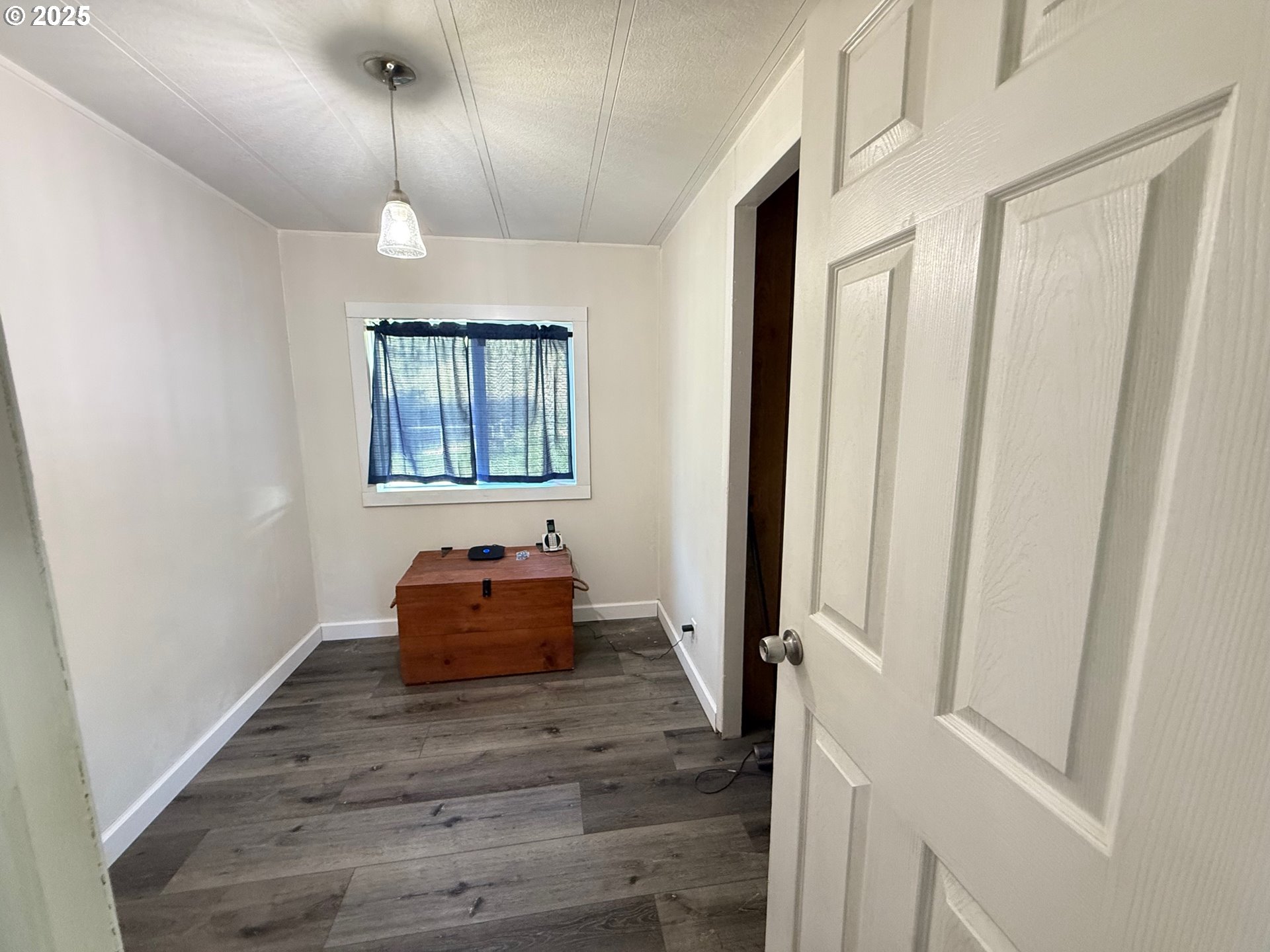 63615 East Birch Creek Road Pilot Rock, OR 97868 - Photo 6 of 15 a hallway with a window and wooden floor