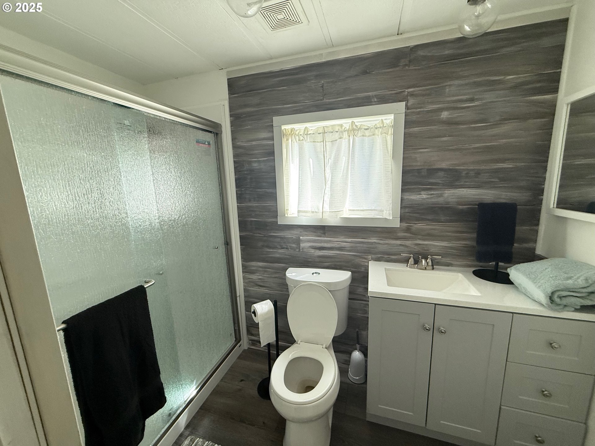63615 East Birch Creek Road Pilot Rock, OR 97868 - Photo 9 of 15 a bathroom with a granite countertop toilet sink and mirror