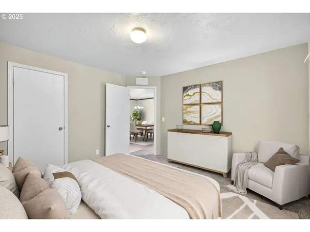 a bedroom with a bed and a couch