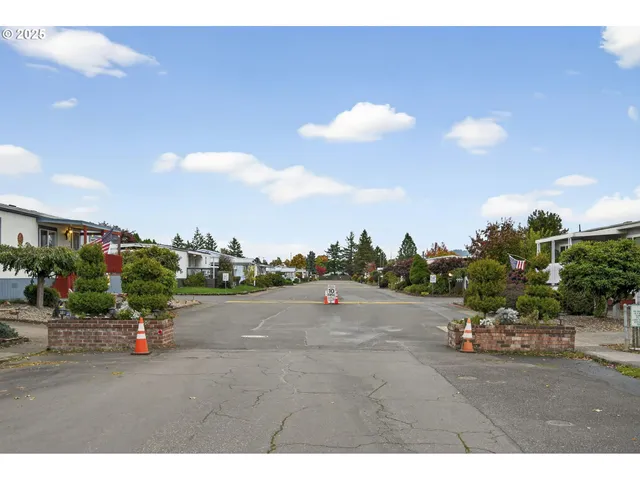 a picture of a road with a building in the background