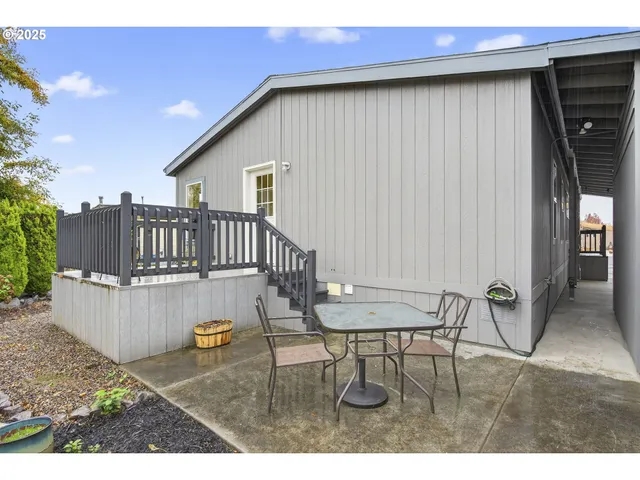 a view of a patio with a table and chairs