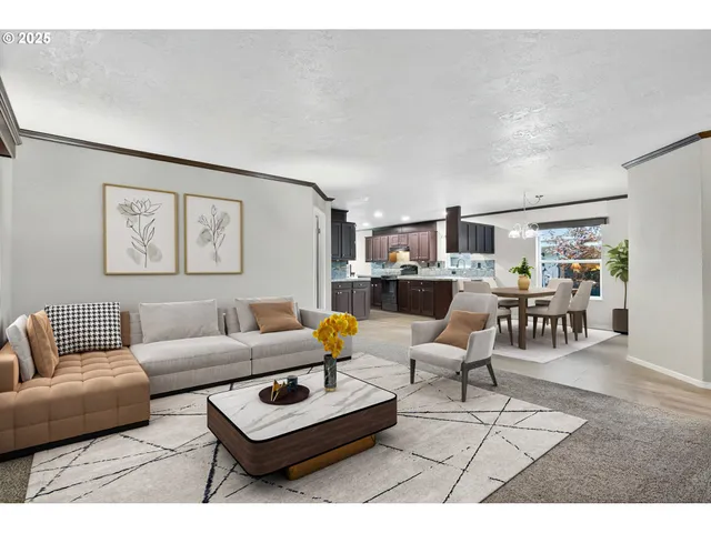 a living room with furniture and view of kitchen