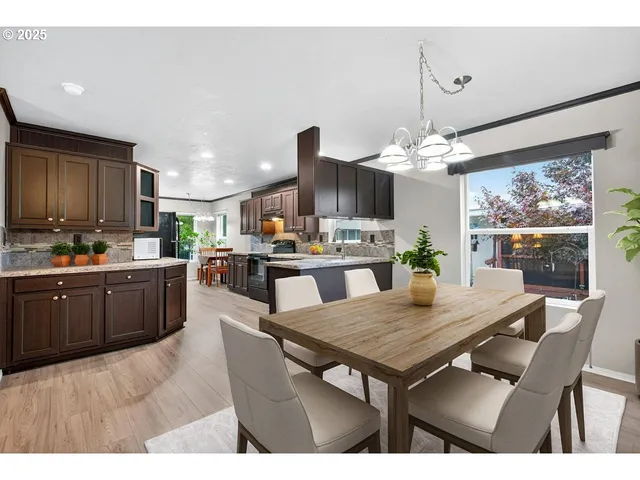 a kitchen with a table and chairs in it