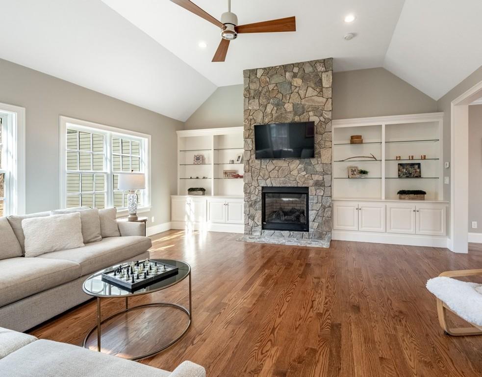 427 Lowell Road Concord, MA 01742 - Photo 11 of 35 a living room with furniture and a fireplace