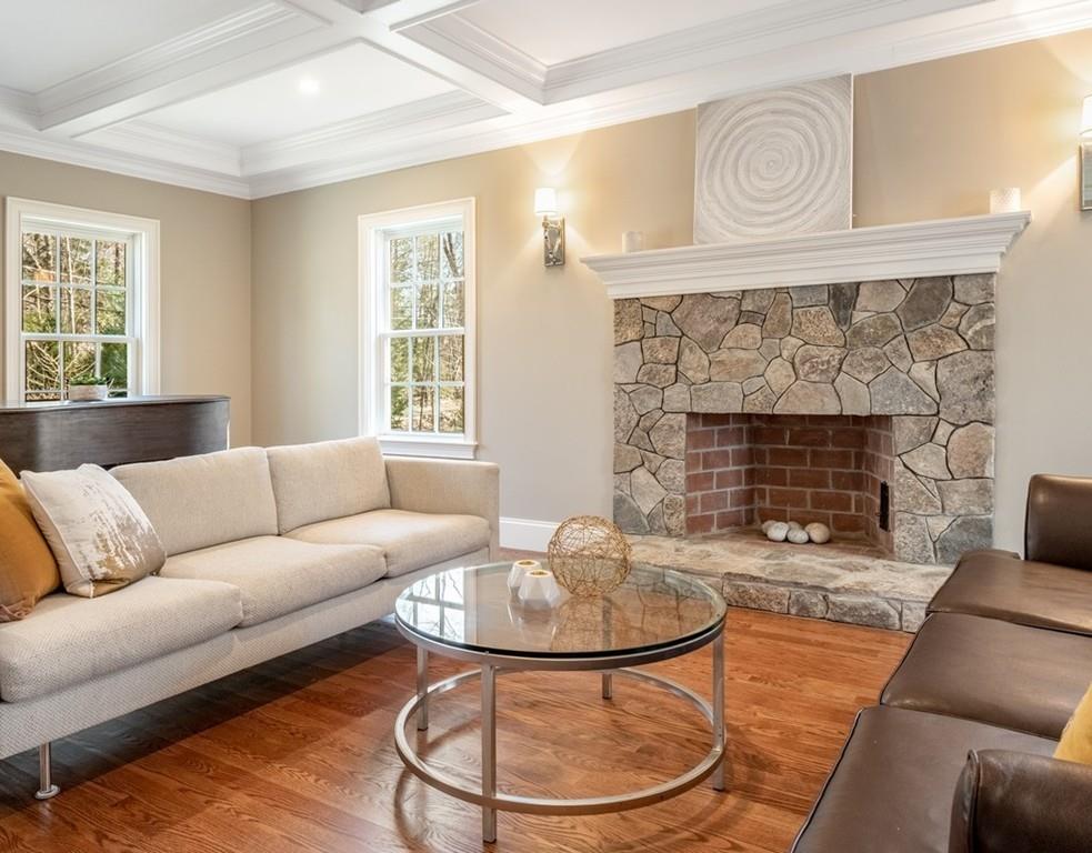 427 Lowell Road Concord, MA 01742 - Photo 15 of 35 a living room with furniture and a fireplace