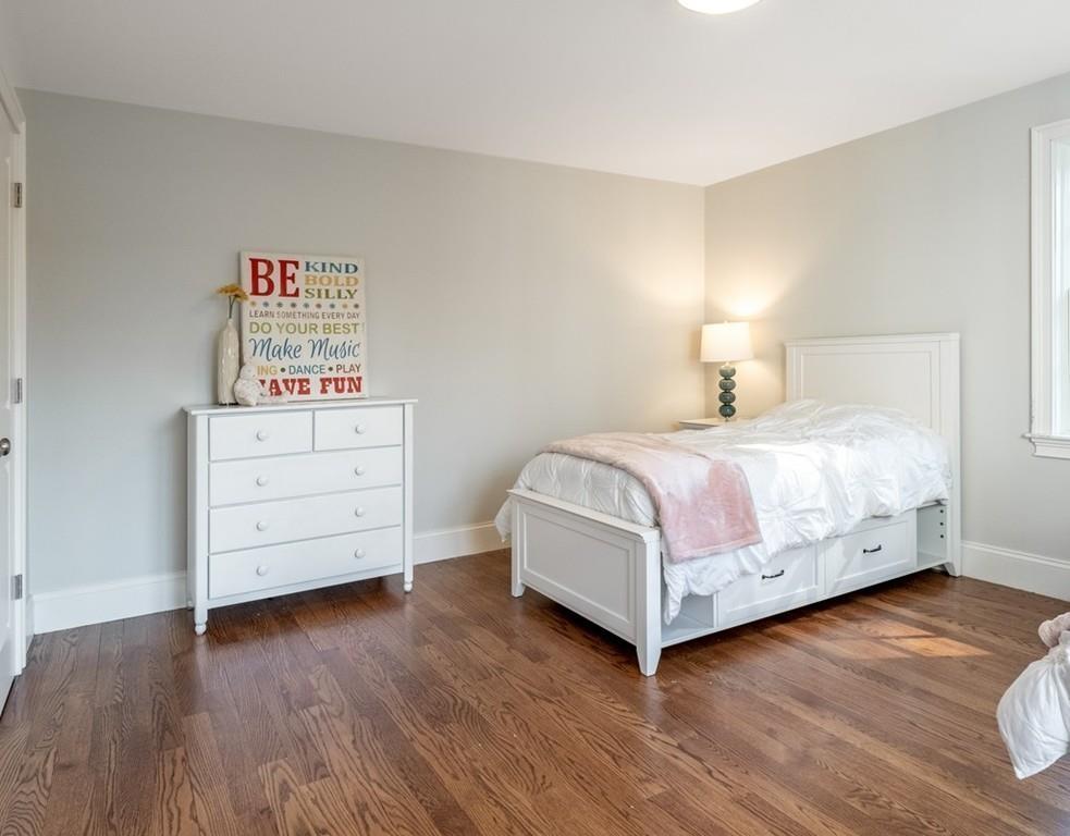 427 Lowell Road Concord, MA 01742 - Photo 25 of 35 a bedroom with a bed and a closet