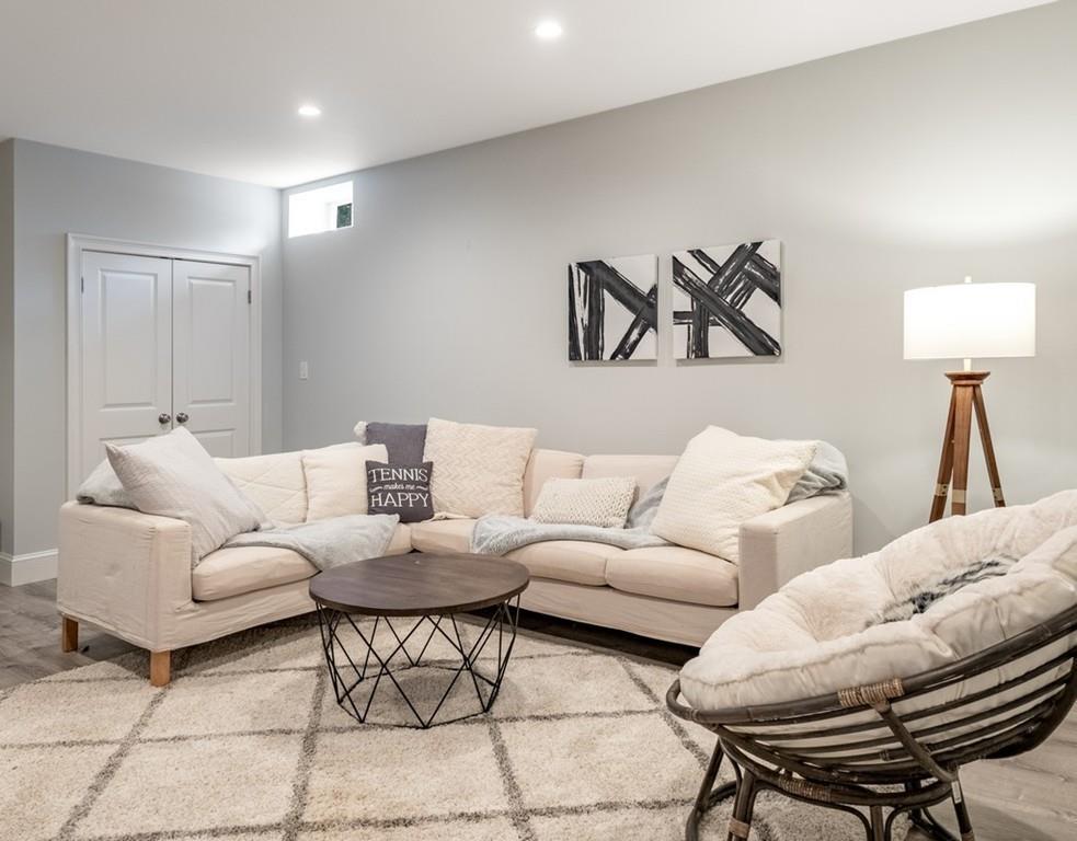 427 Lowell Road Concord, MA 01742 - Photo 29 of 35 a living room with furniture and a lamp