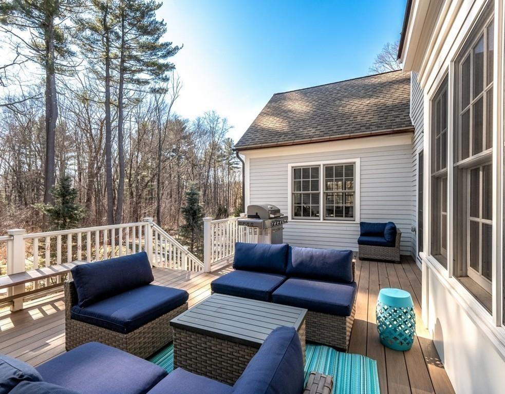 427 Lowell Road Concord, MA 01742 - Photo 31 of 35 a view of a patio with couches chairs and wooden floor