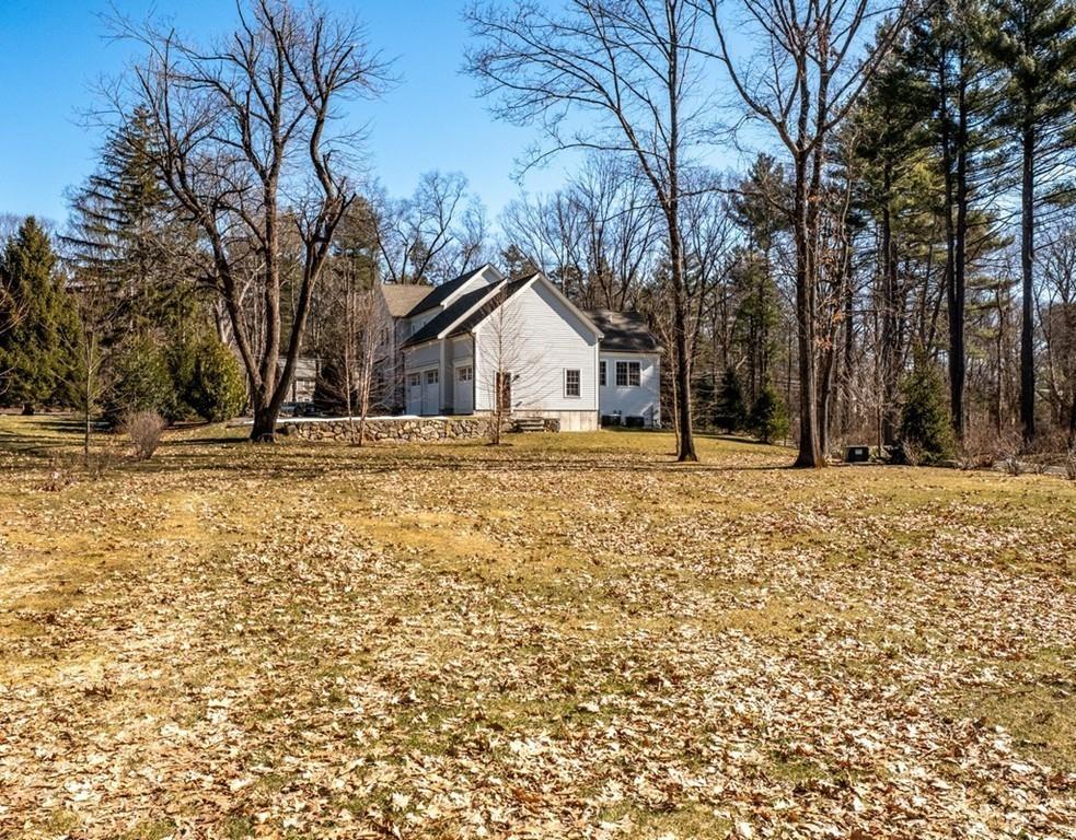 427 Lowell Road Concord, MA 01742 - Photo 34 of 35 a view of house with a yard