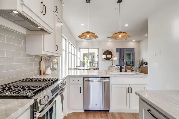 a kitchen with a stove and a sink