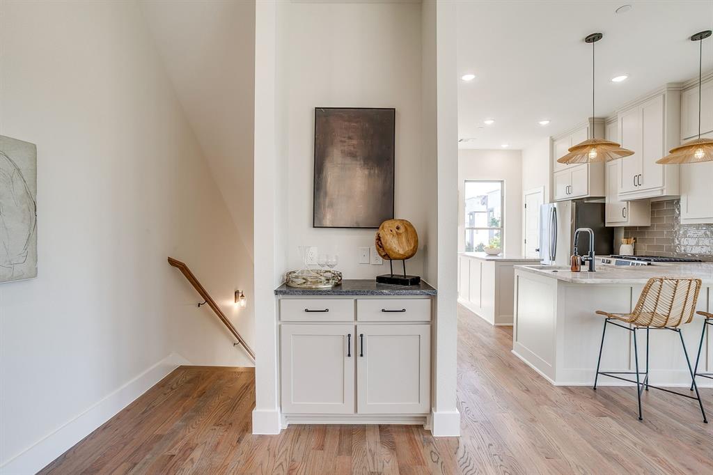 300 Foch Street, Unit 140 Fort Worth, TX 76107 - Photo 2 of 39 a living room with furniture and wooden floor