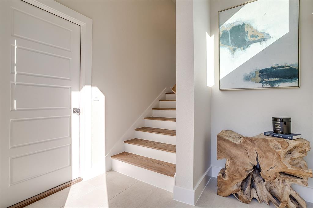 300 Foch Street, Unit 140 Fort Worth, TX 76107 - Photo 21 of 39 a view of entryway and hall with wooden floor