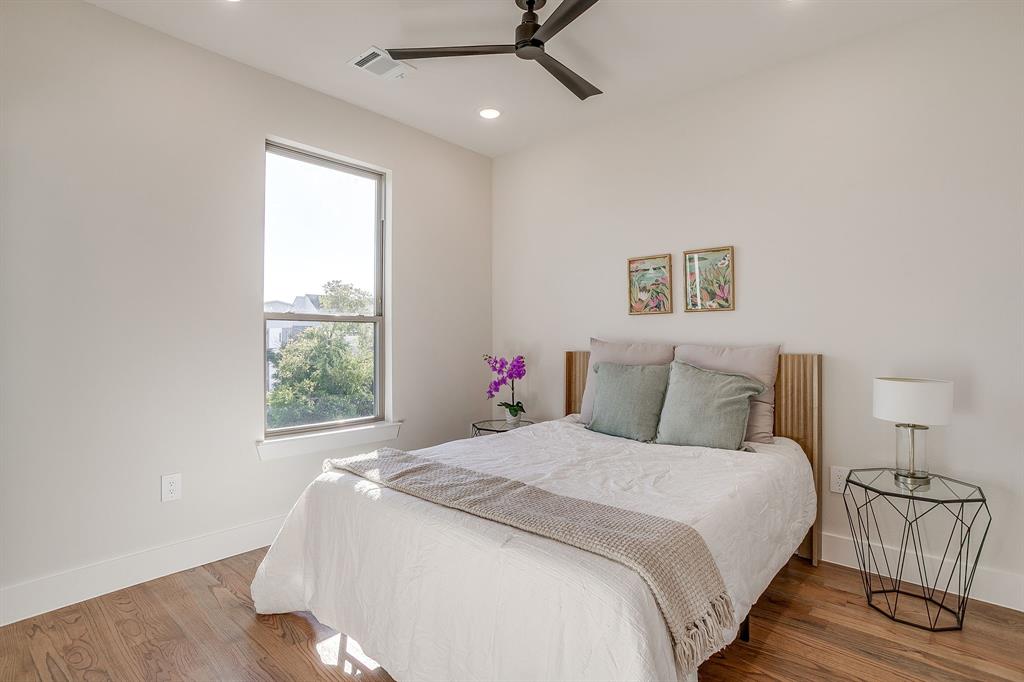 300 Foch Street, Unit 140 Fort Worth, TX 76107 - Photo 30 of 39 a bedroom with a large bed and a window