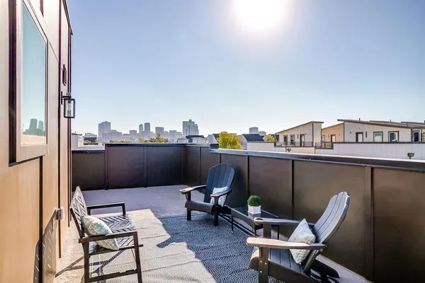 a view of a balcony with chairs