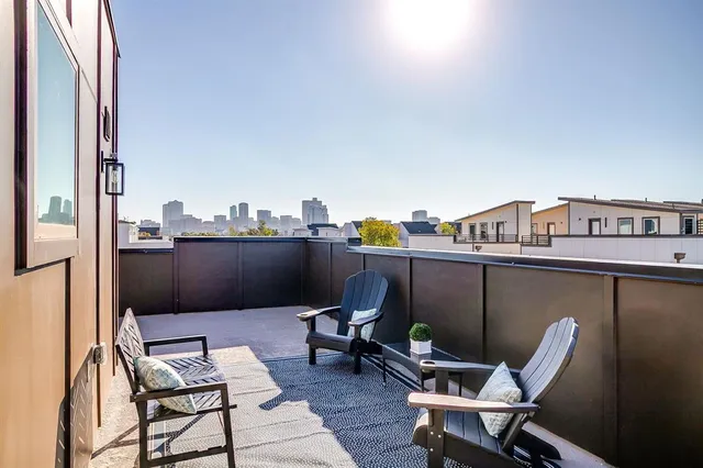 a view of a balcony with chairs