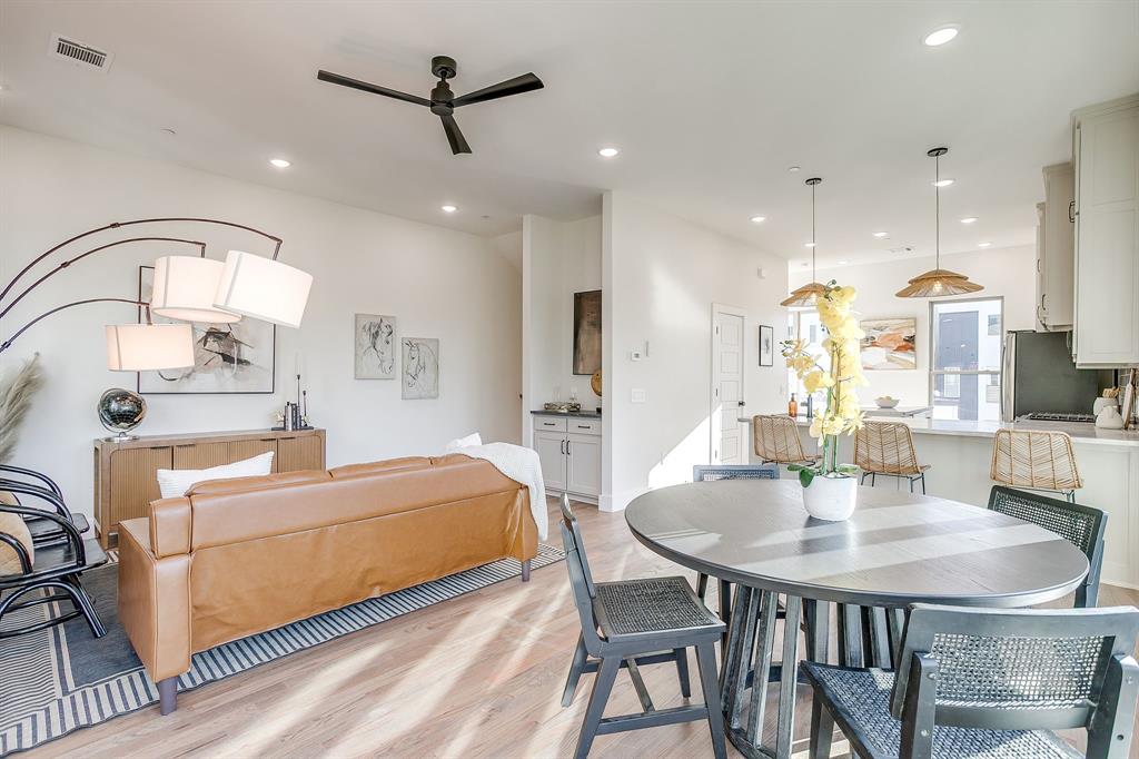 300 Foch Street, Unit 140 Fort Worth, TX 76107 - Photo 10 of 39 a living room with stainless steel appliances furniture a dining table and a chandelier