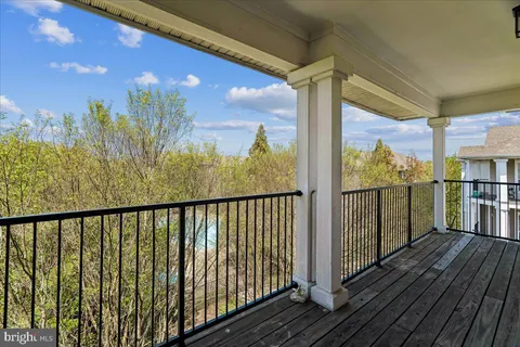 a view of a balcony with wooden floor