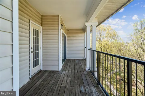 a view of a balcony with wooden floor