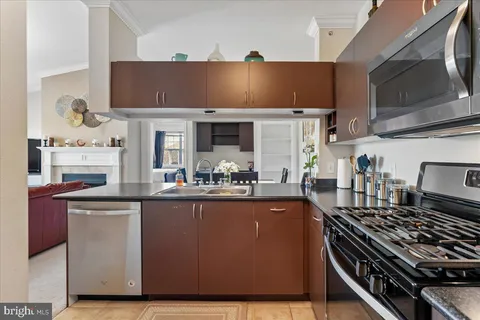 a kitchen with counter top space and appliances