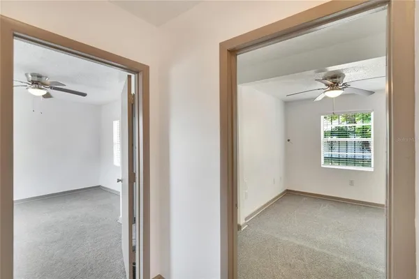 a view of an empty room with a window