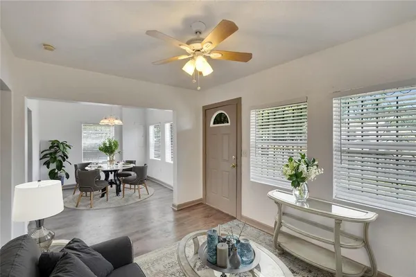 a living room with furniture and a large window