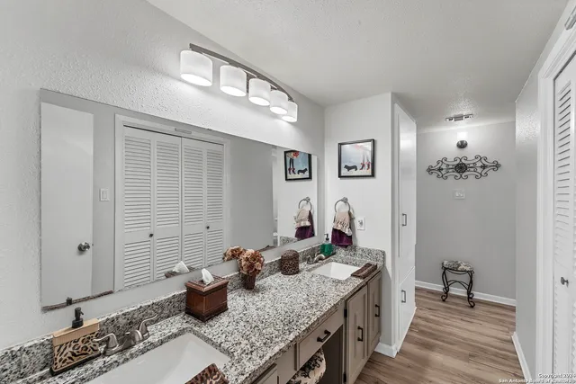 a kitchen with sink stove and view living room