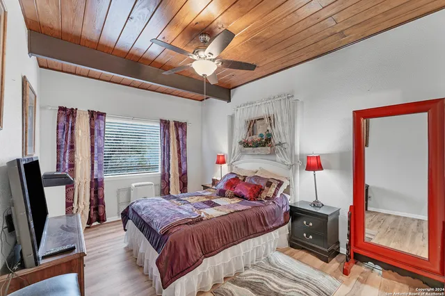 a bed room with a bed and a window