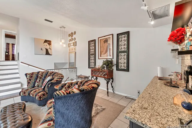 a living room with furniture and a couch