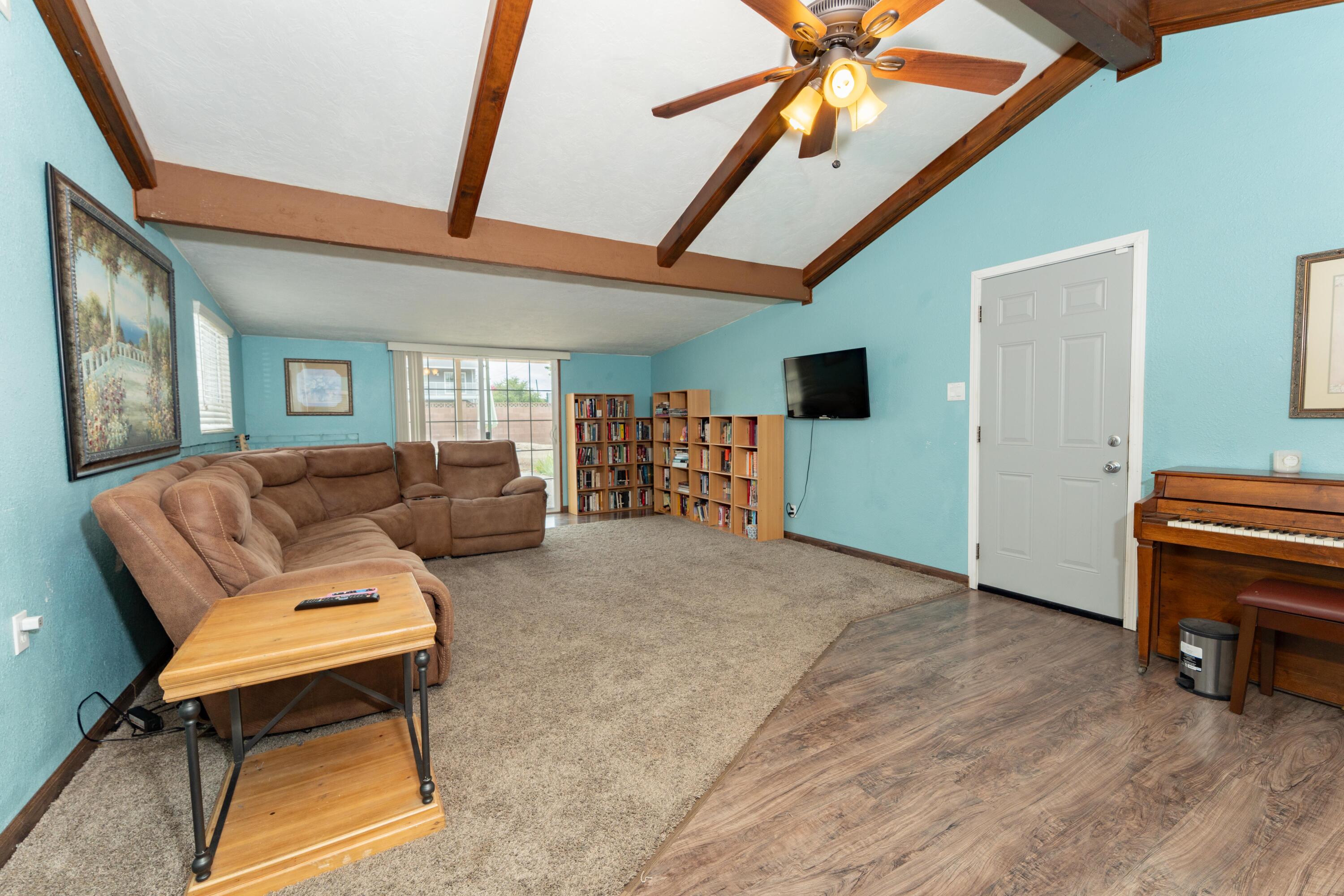 570 North Birch Avenue Reedley, CA 93654 - Photo 23 of 52 a living room with furniture and a flat screen tv