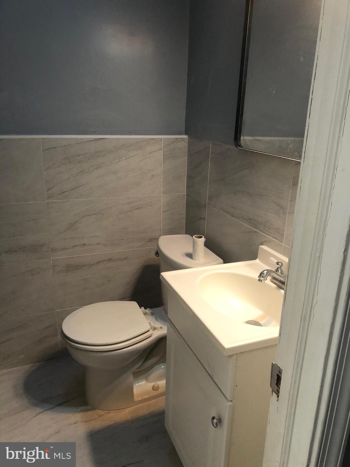 8550 Tolbut Street Philadelphia, PA 19152 - Photo 13 of 24 a bathroom with a toilet and a sink