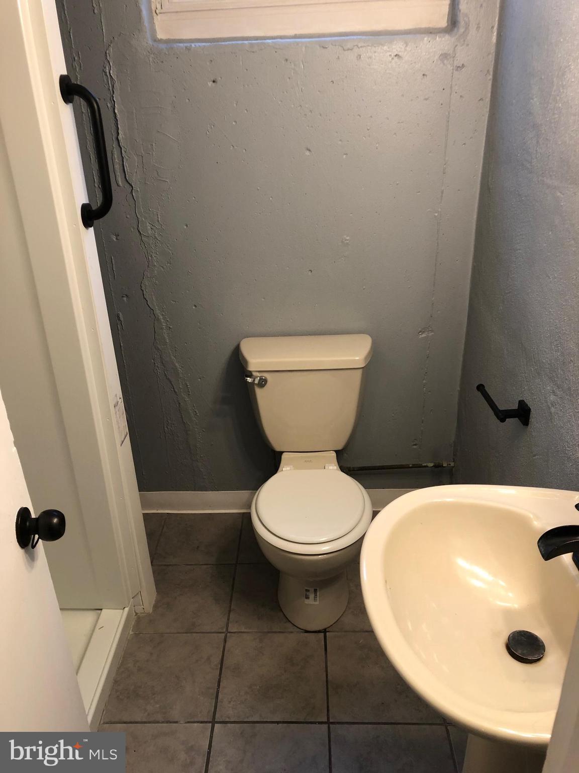 8550 Tolbut Street Philadelphia, PA 19152 - Photo 21 of 24 a bathroom with a sink and toilet