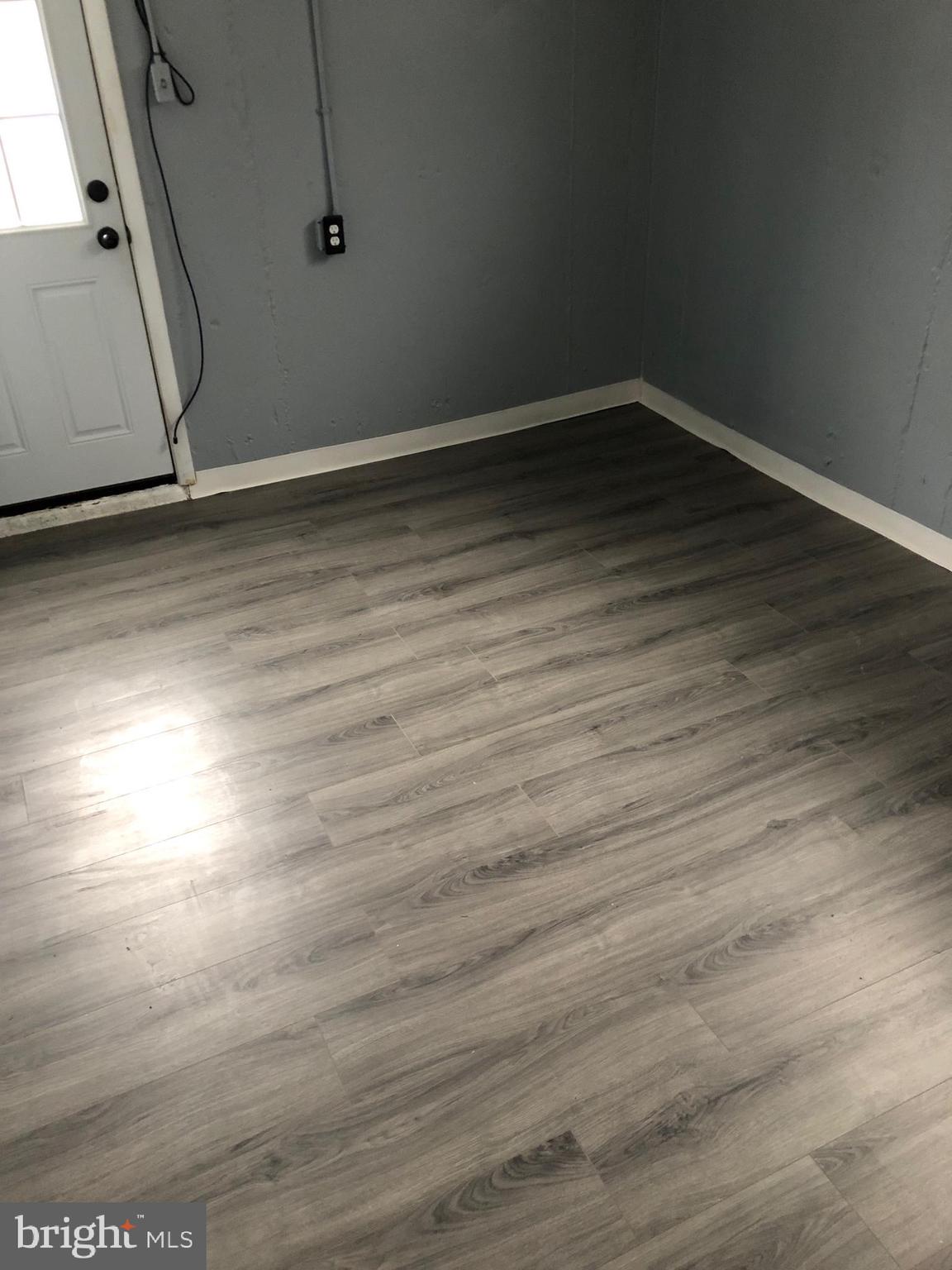 8550 Tolbut Street Philadelphia, PA 19152 - Photo 23 of 24 a room with wooden floor and window