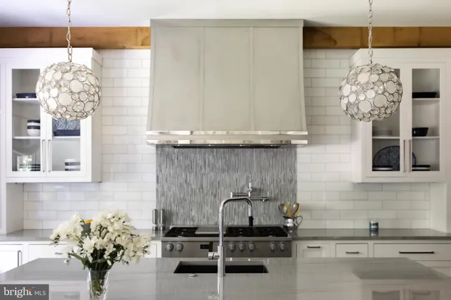 a bedroom with a large bed and a fireplace