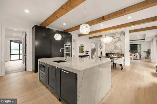 a spacious bathroom with a tub sink mirror and shower