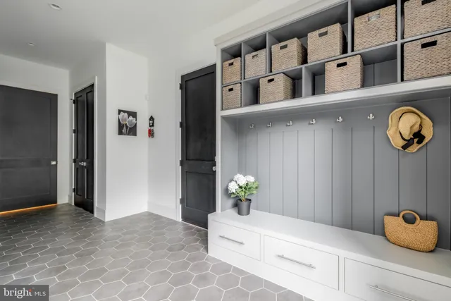 a spacious bedroom with a bed and a large window