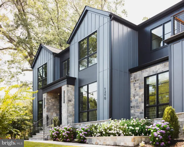 a view of a lobby with furniture and a chandelier