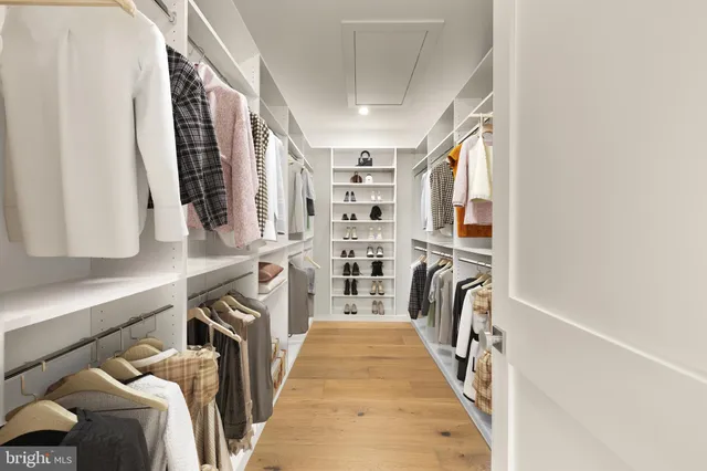 a view of a house with pool and chairs