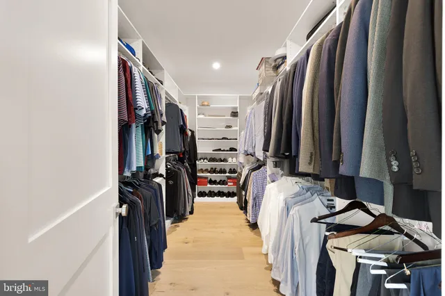 a view of green field with trees in the background