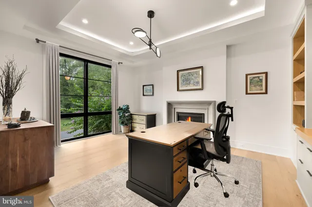 a view of a dining room with furniture and window