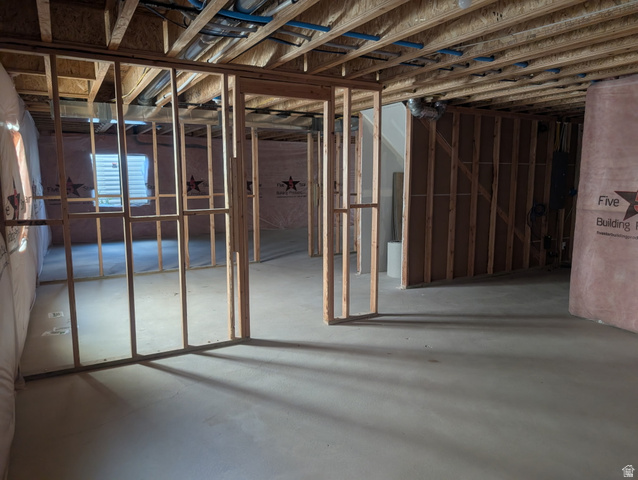 3831 South Powderwood Lane, Unit 111 Mapleton, UT 84664 - Photo 10 of 12 Unfinished lower level with exposed ceiling joists and wood framing