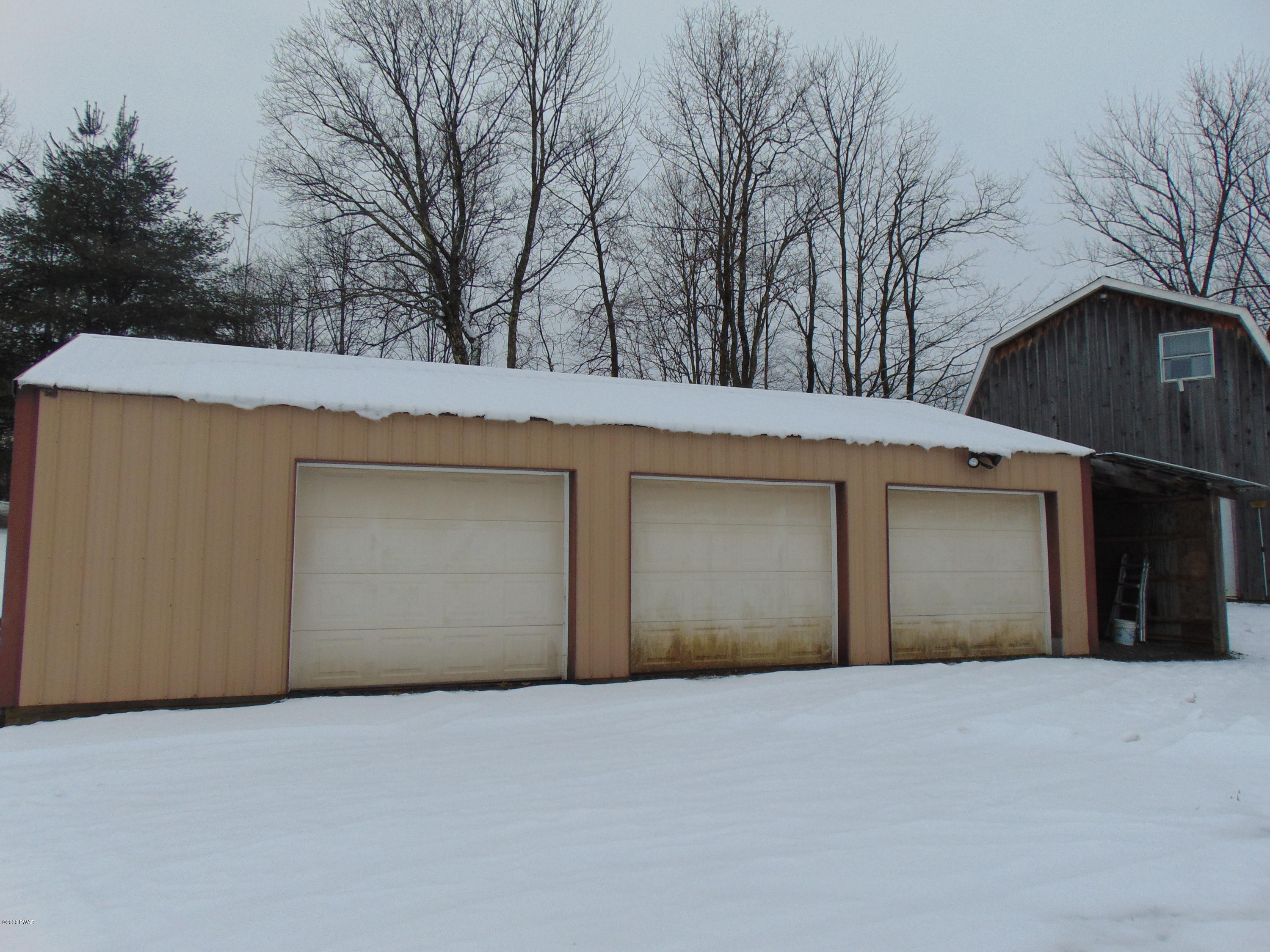 135 Puzo Road Montrose, PA 18801 - Photo 14 of 32 a view of garage and yard