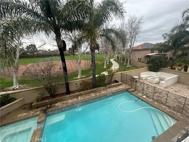 a view of a backyard with sitting area
