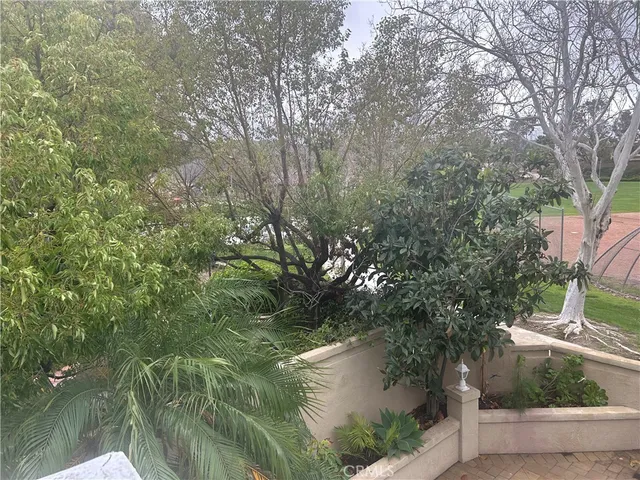 a view of a backyard with sitting area