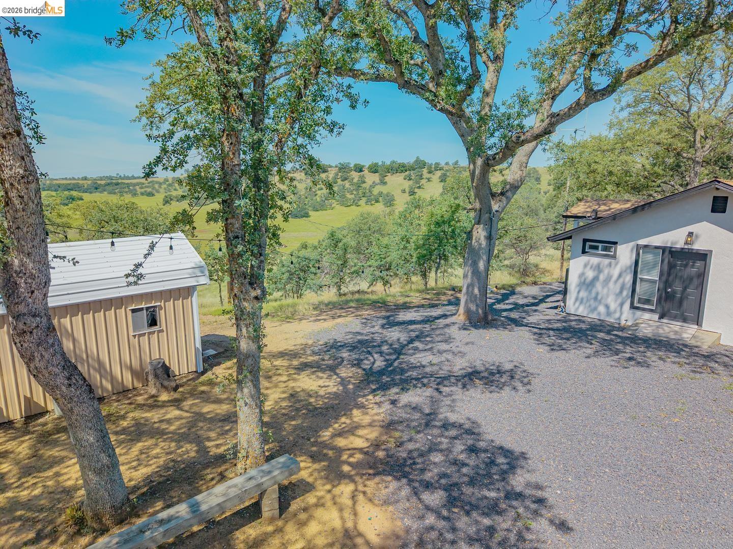 14594 Perricone Road Jamestown, CA 95327 - Photo 7 of 39 a view of a house with a tree in the background
